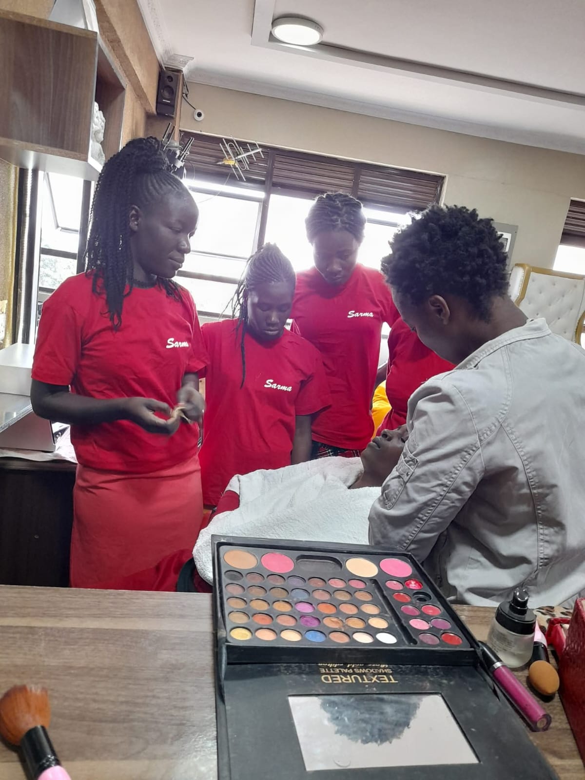 Sarma makeup artists working on a client